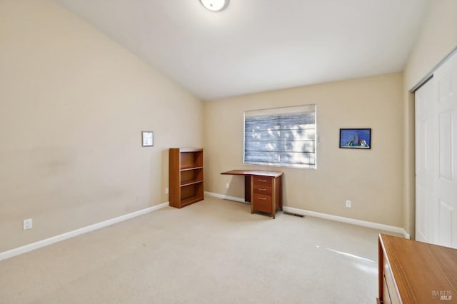 misc room featuring lofted ceiling and light colored carpet