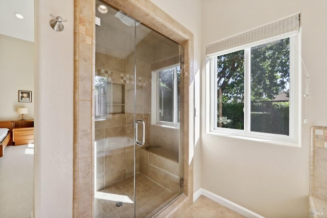 bathroom with a shower with shower door