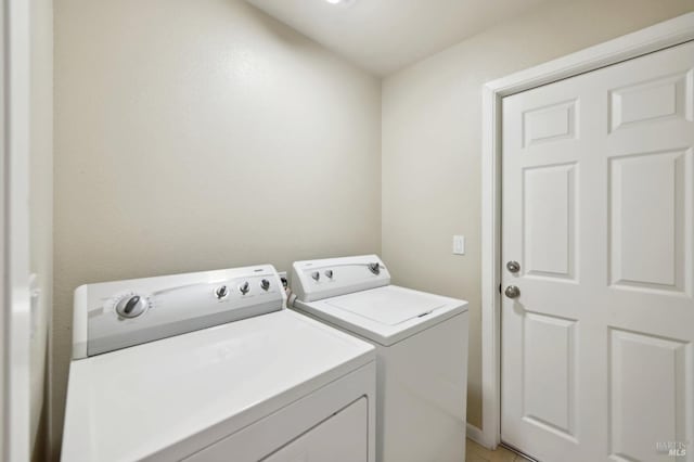 laundry room with separate washer and dryer