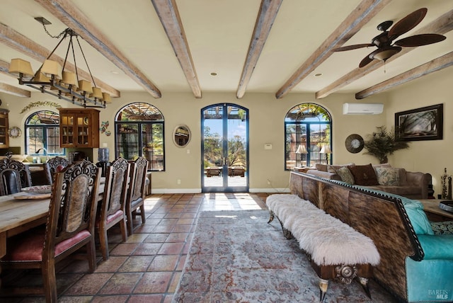 dining space featuring ceiling fan, french doors, beam ceiling, and a wall unit AC