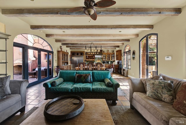 living room featuring ceiling fan and beam ceiling