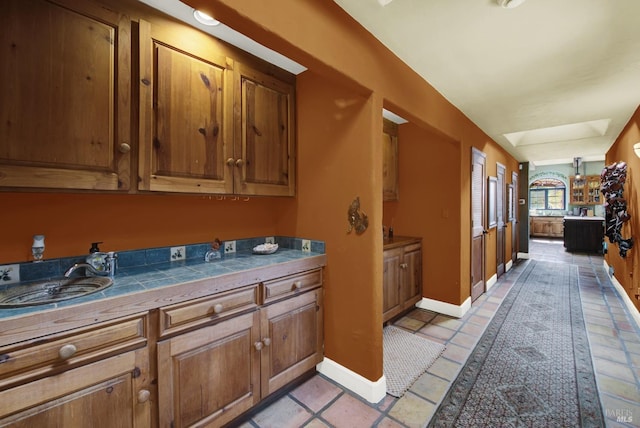 kitchen with sink and tile counters