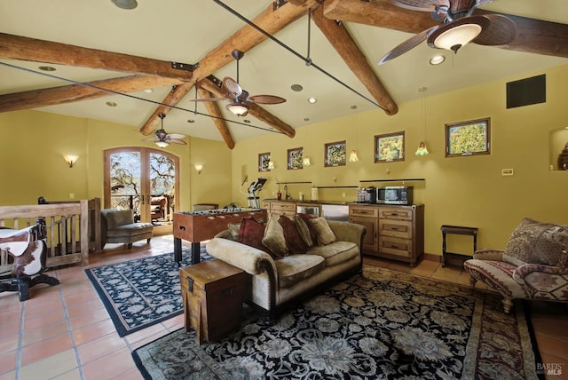 tiled living room featuring ceiling fan and lofted ceiling with beams