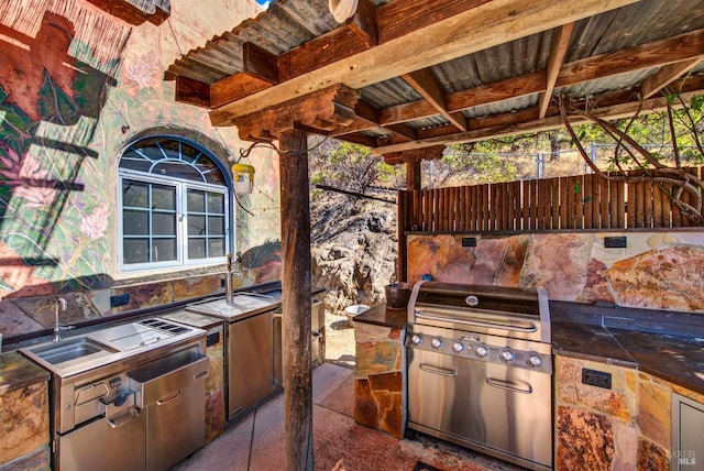 view of patio / terrace featuring area for grilling and sink