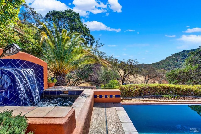 view of pool featuring a mountain view