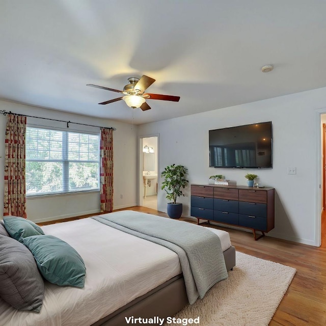 10951 River Rd, Courtland, CA 95615 - bedroom featuring ceiling fan, light hardwood / wood-style floors, and ensuite bath