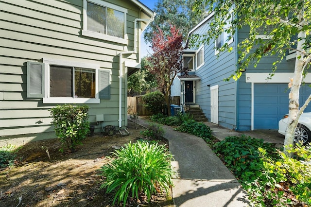 view of side of property with a garage