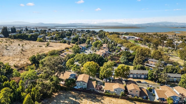 birds eye view of property featuring a water and mountain view