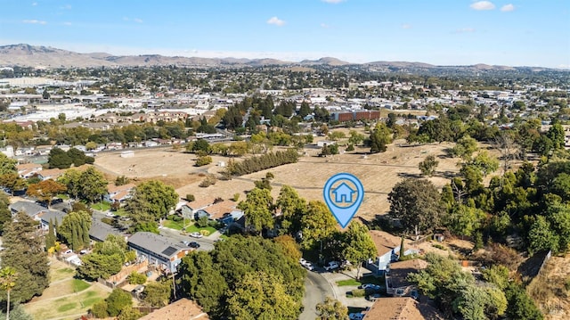 birds eye view of property with a mountain view