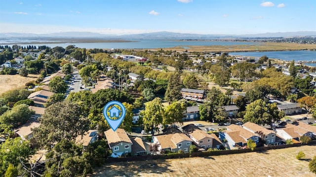 bird's eye view with a water and mountain view