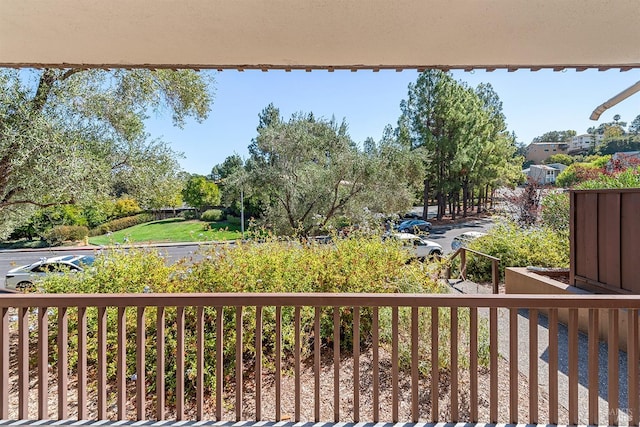 view of yard with a balcony