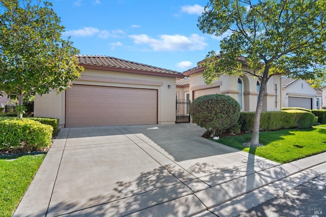 mediterranean / spanish-style house featuring a garage