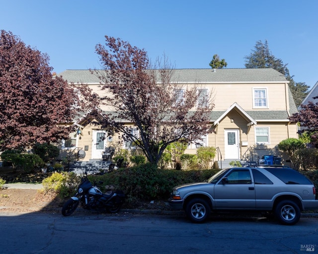 view of front of house with roof with shingles