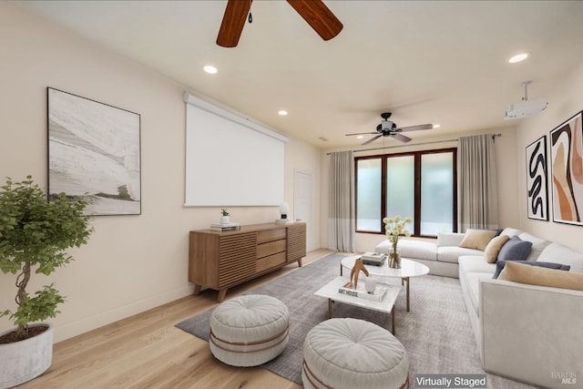 living room with light wood-type flooring and ceiling fan