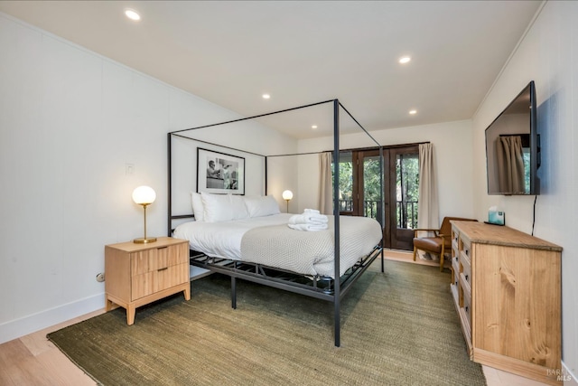 bedroom with hardwood / wood-style flooring