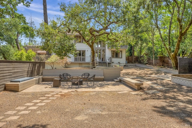 back of property featuring a patio area