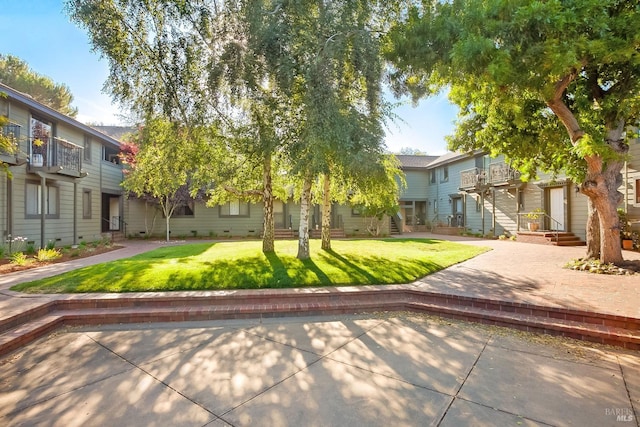 view of front of property with crawl space, a residential view, and a front yard