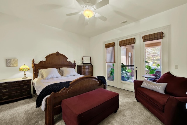 bedroom featuring light carpet, access to exterior, and ceiling fan