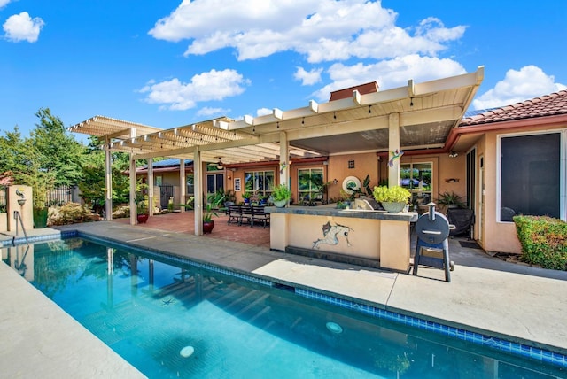 view of swimming pool with a pergola, an outdoor bar, and a patio