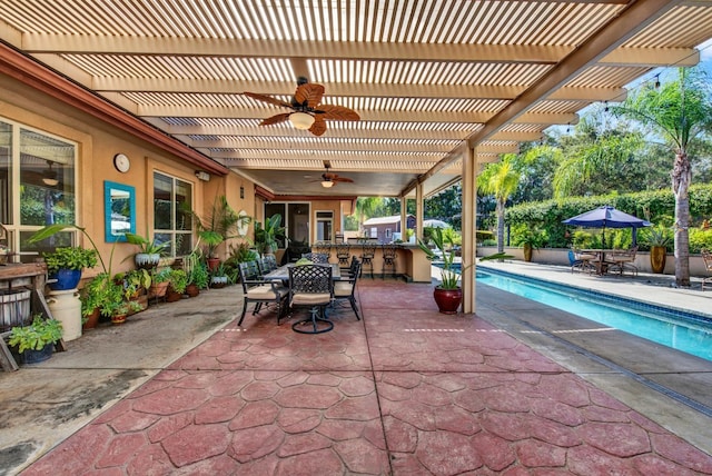 view of patio / terrace featuring an outdoor bar, ceiling fan, and a pergola