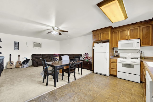 interior space featuring ceiling fan and a wall mounted AC