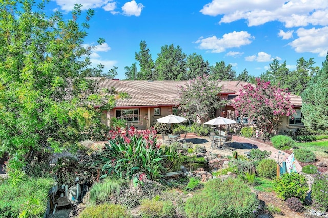 rear view of property featuring a patio area