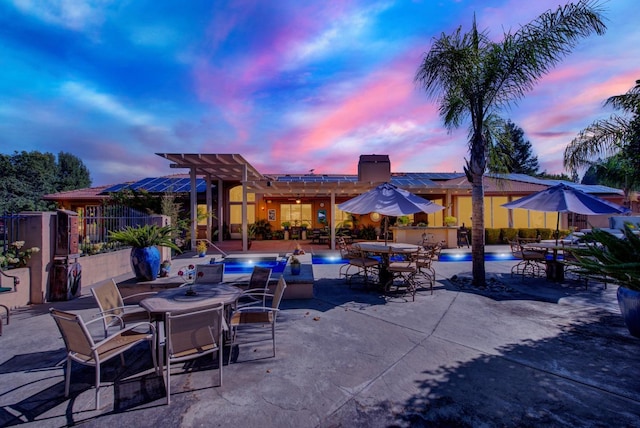 view of patio terrace at dusk