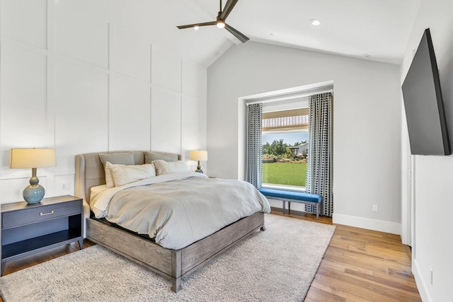 bedroom with vaulted ceiling with beams, ceiling fan, and light wood-type flooring