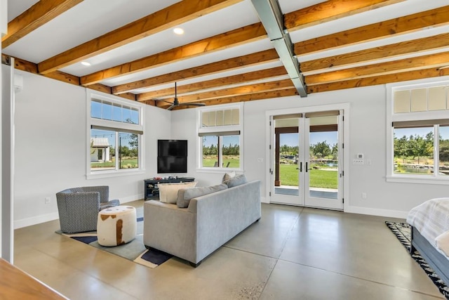 living room featuring beamed ceiling, a wealth of natural light, and french doors