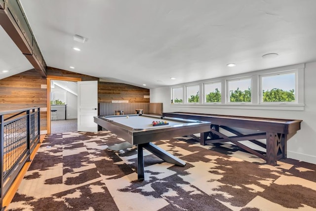 game room featuring carpet, pool table, lofted ceiling, and wood walls