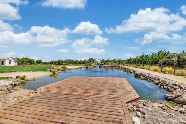 dock area with a water view