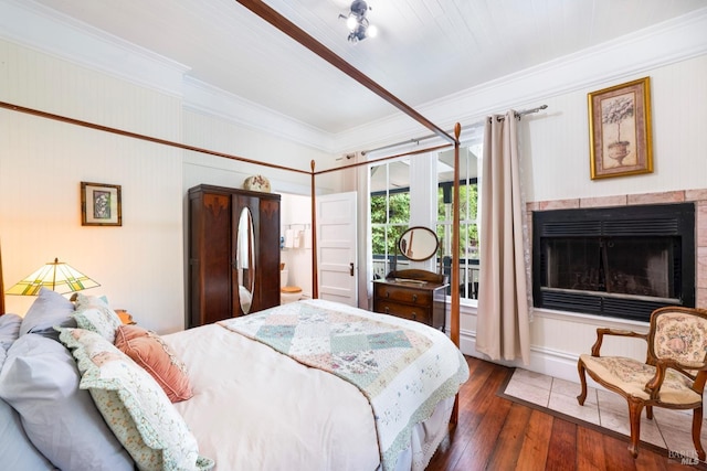 12130 Hwy 116, Guerneville, CA 95446 - bedroom with ornamental molding, access to exterior, hardwood / wood-style floors, and a fireplace