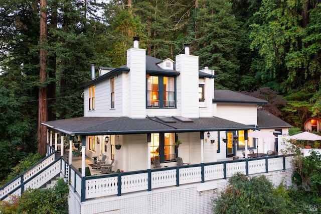 12130 Hwy 116, Guerneville, CA 95446 - view of front of home featuring a chimney, a shingled roof, and covered porch