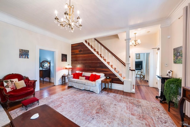 12130 Hwy 116, Guerneville, CA 95446 - living area featuring a chandelier, wood-type flooring, stairway, and crown molding