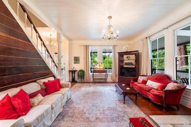 12130 Hwy 116, Guerneville, CA 95446 - living area with a chandelier, plenty of natural light, stairway, wood finished floors, and crown molding