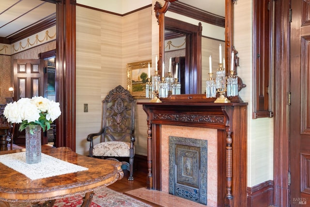 living room with wood-type flooring and ornamental molding