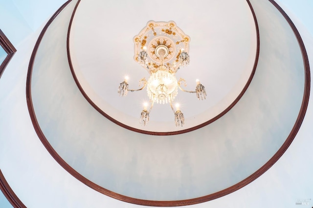 interior details featuring a notable chandelier