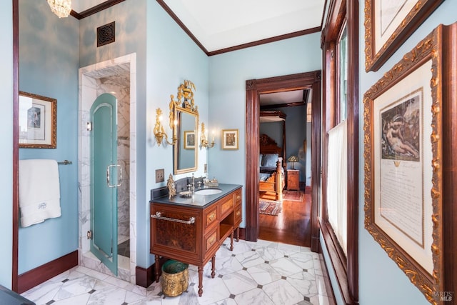 bathroom featuring hardwood / wood-style flooring, a shower with door, vanity, and crown molding