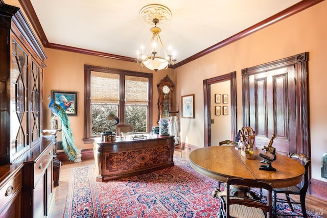 office featuring an inviting chandelier, crown molding, and light hardwood / wood-style floors