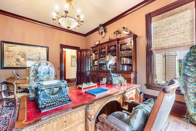 office space with wood-type flooring, ornamental molding, and a notable chandelier