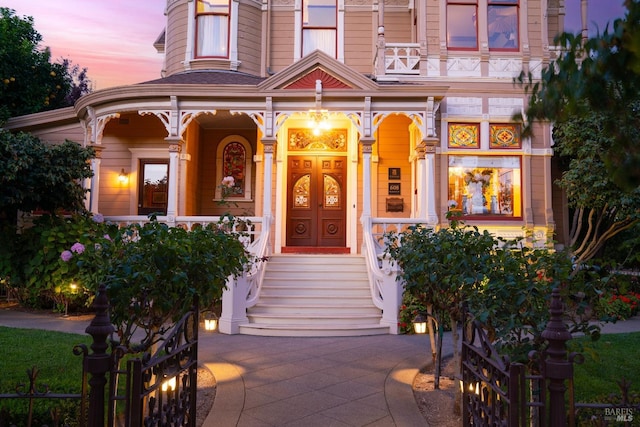 exterior entry at dusk with a porch