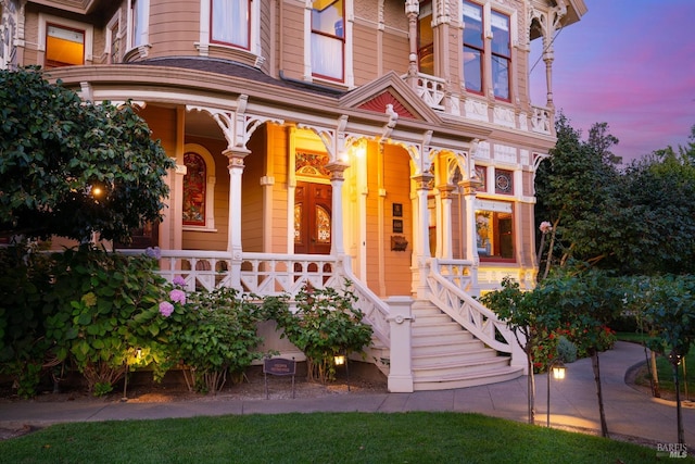 view of exterior entry at dusk