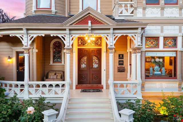 view of exterior entry at dusk