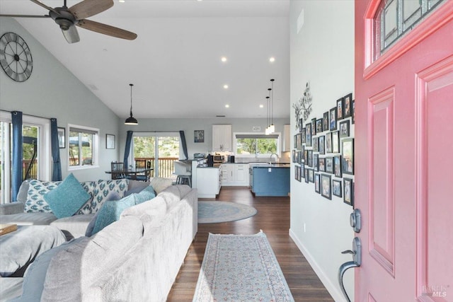 living room featuring dark wood-style floors, recessed lighting, ceiling fan, and high vaulted ceiling