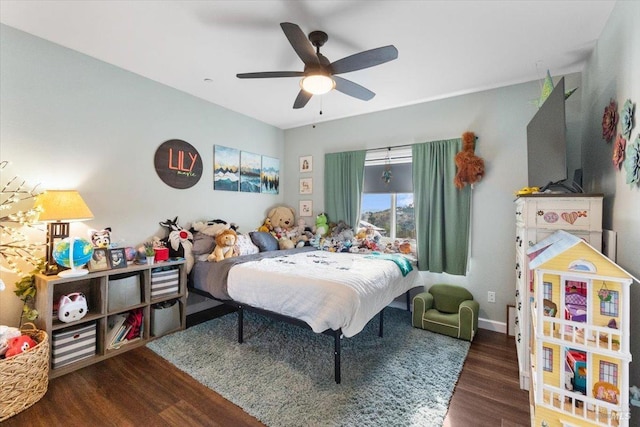 bedroom with ceiling fan and wood finished floors