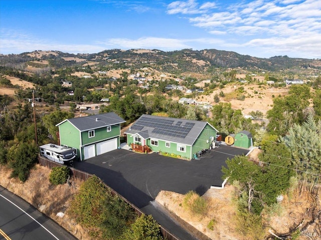 birds eye view of property with a mountain view