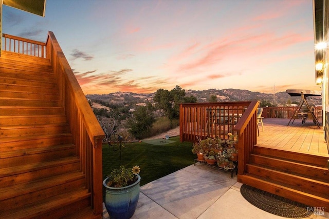 deck at dusk with a patio area