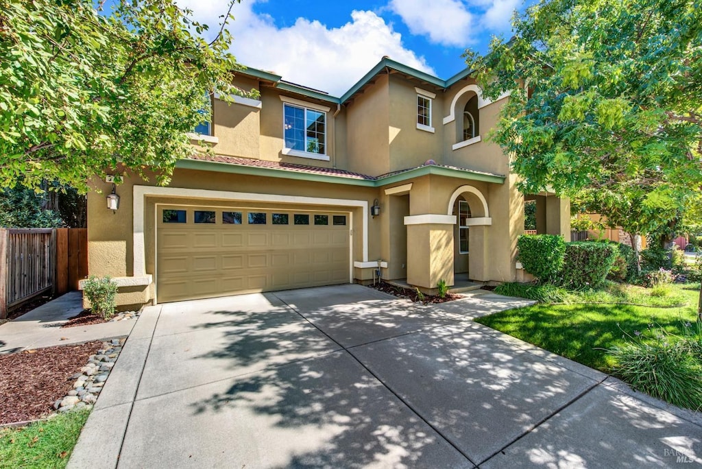 mediterranean / spanish-style house featuring a garage