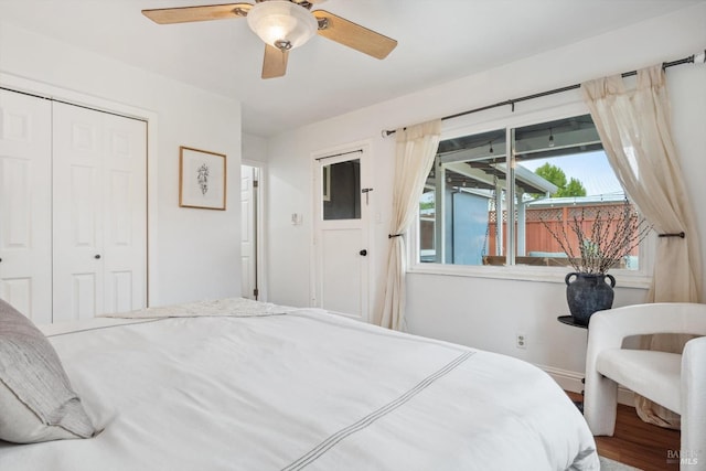 bedroom featuring hardwood / wood-style floors, a closet, and ceiling fan