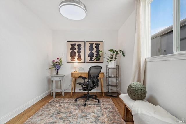 office with hardwood / wood-style flooring